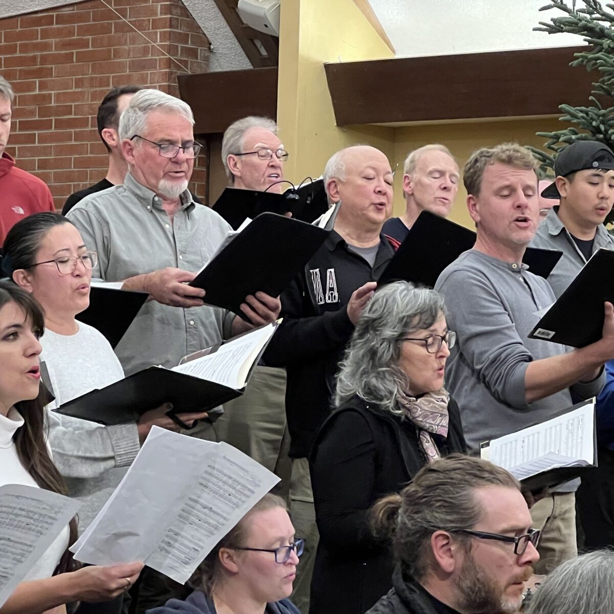 Soli Deo Gloria choir members singing during rehearsal