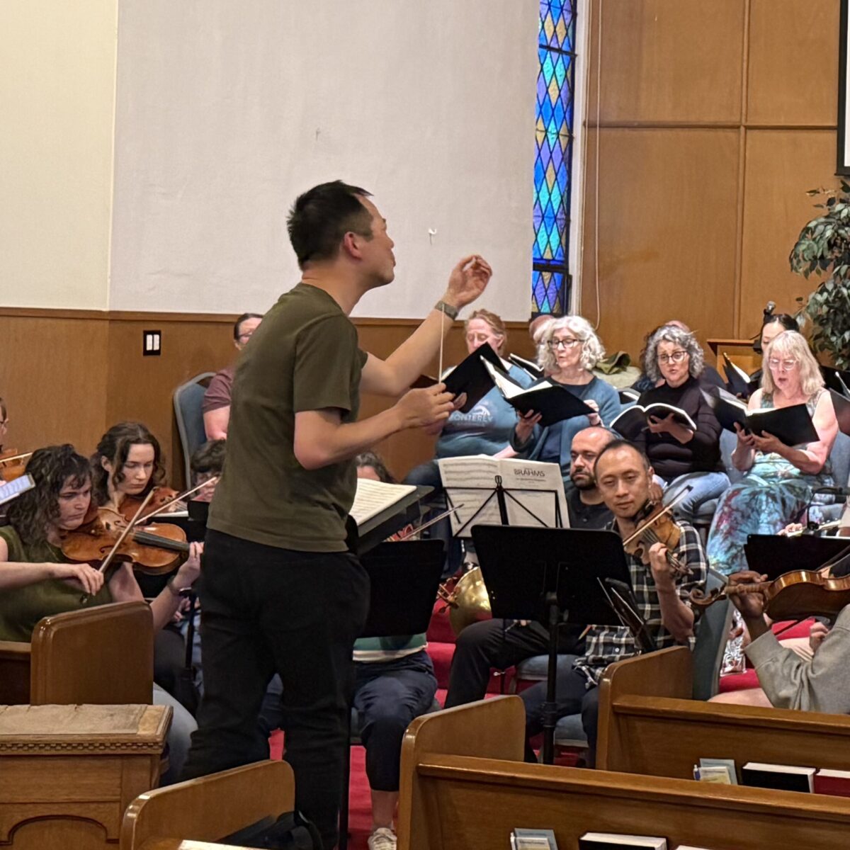 Soli Deo Gloria musical director conducting the choir