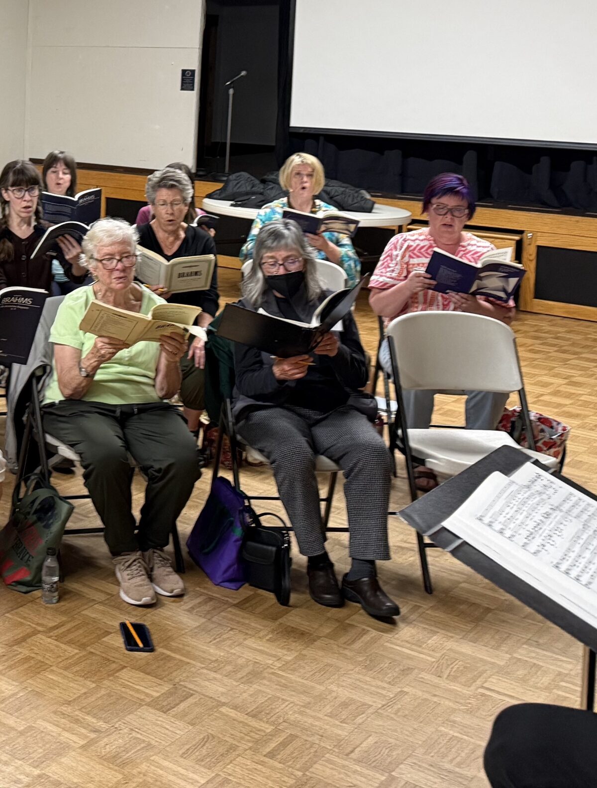 Soli Deo Gloria singers rehearsing together